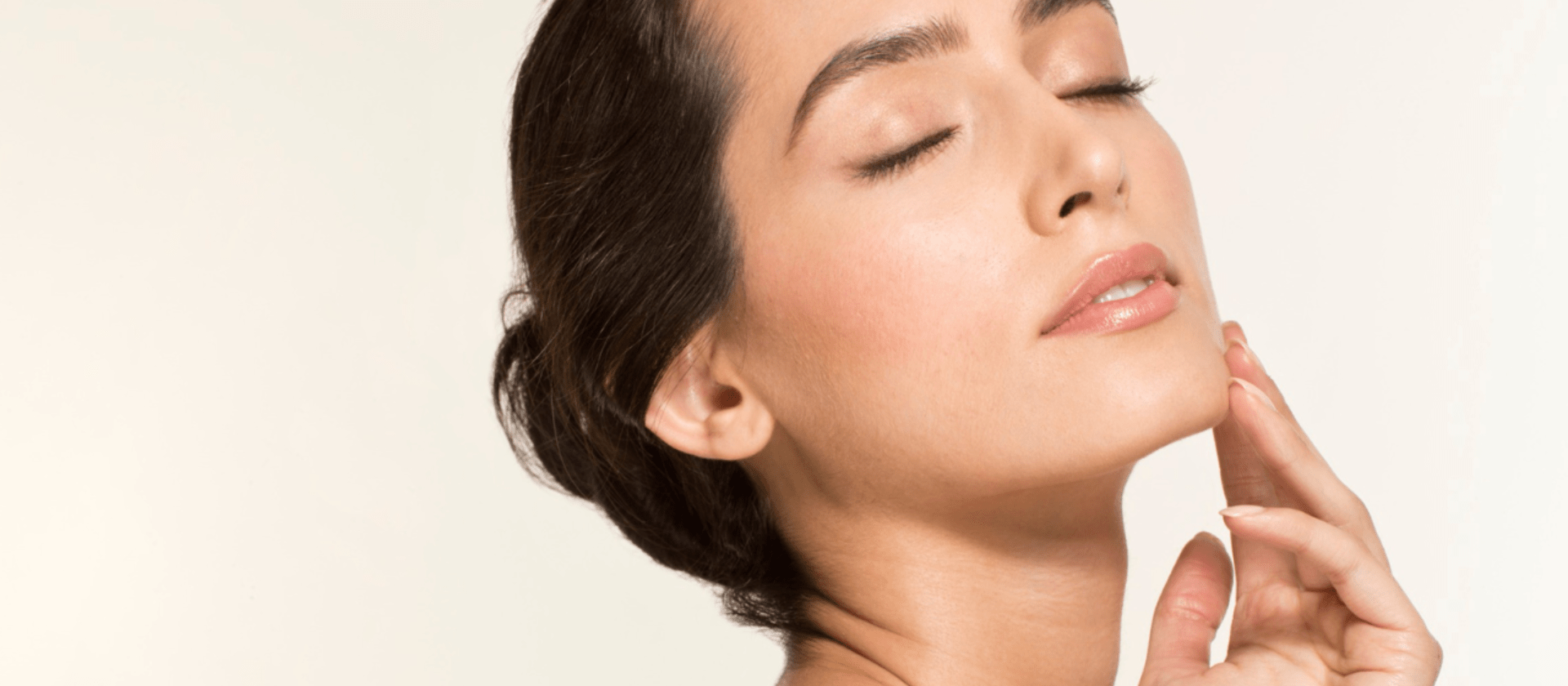 woman touching her face