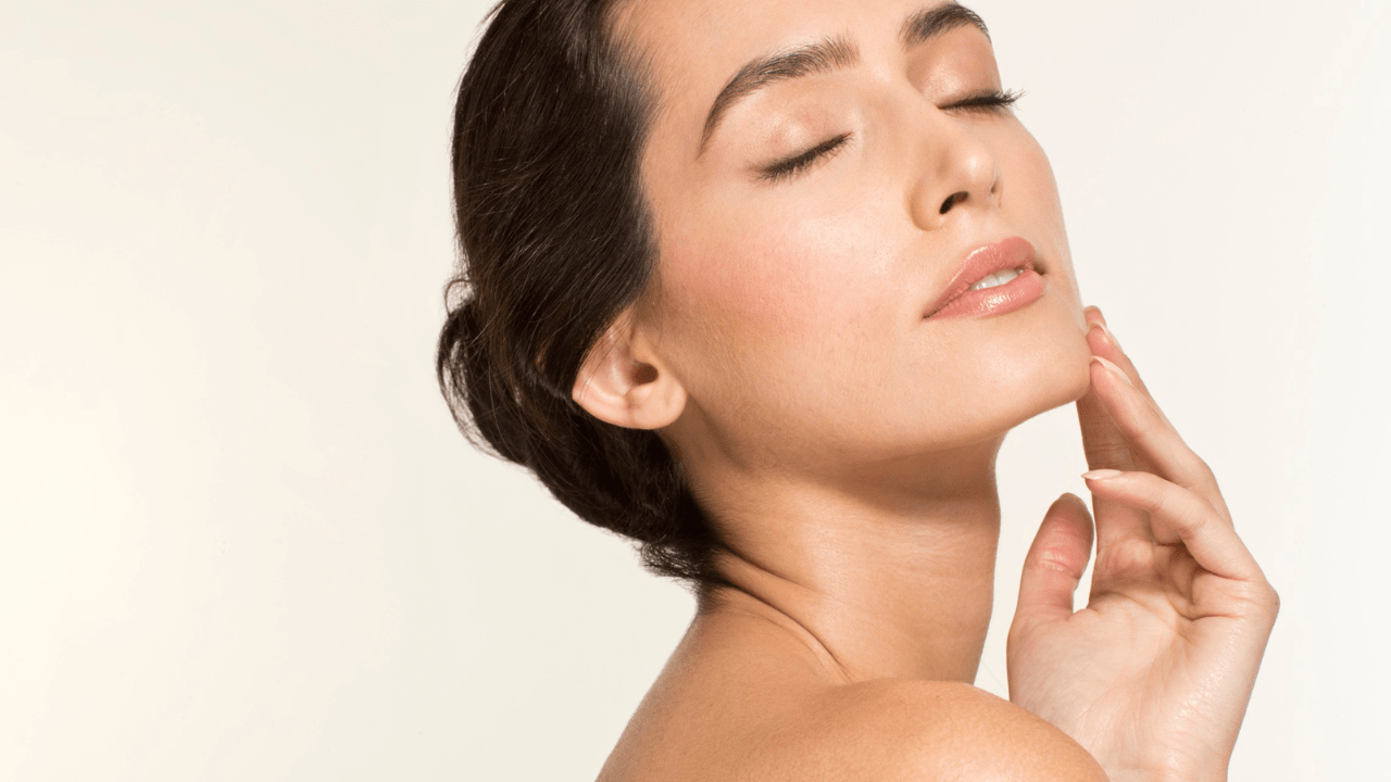 woman touching her face