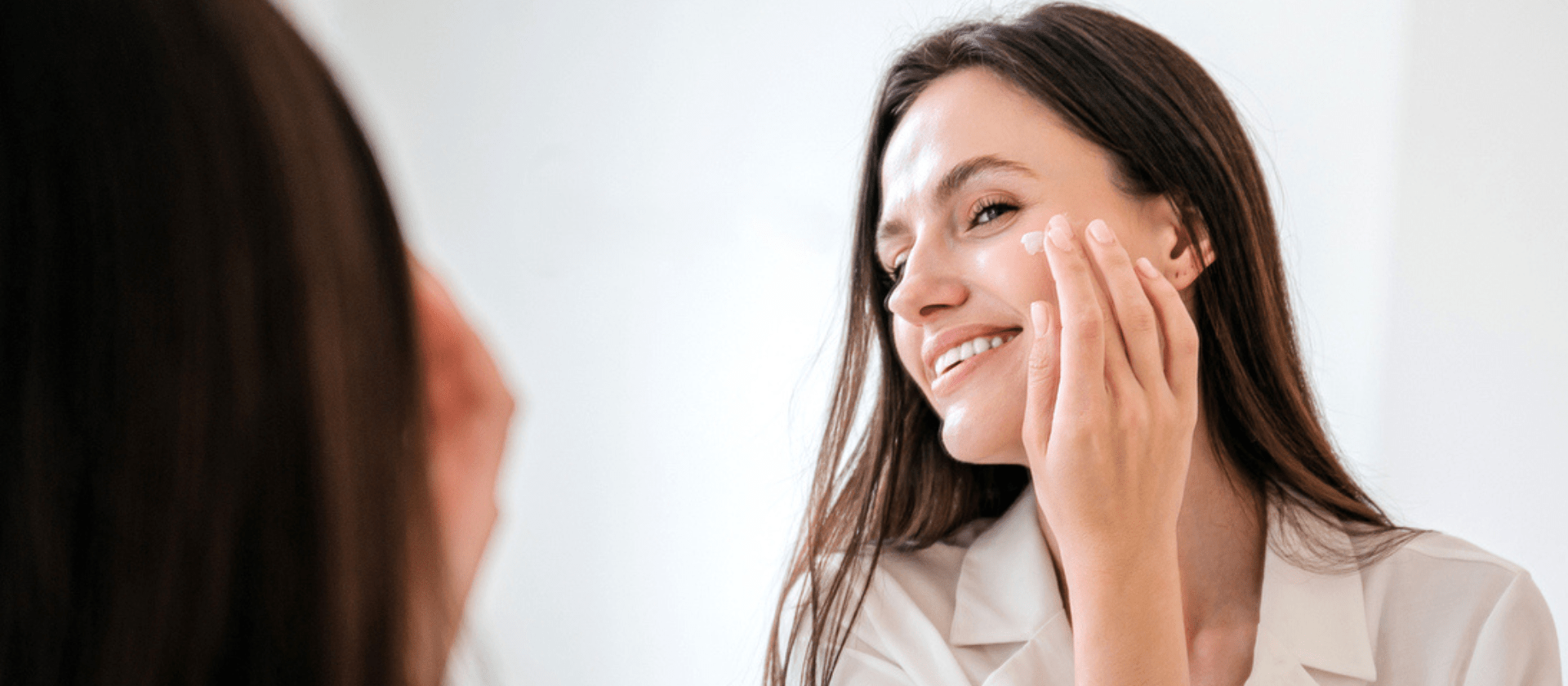 woman looking in the mirror