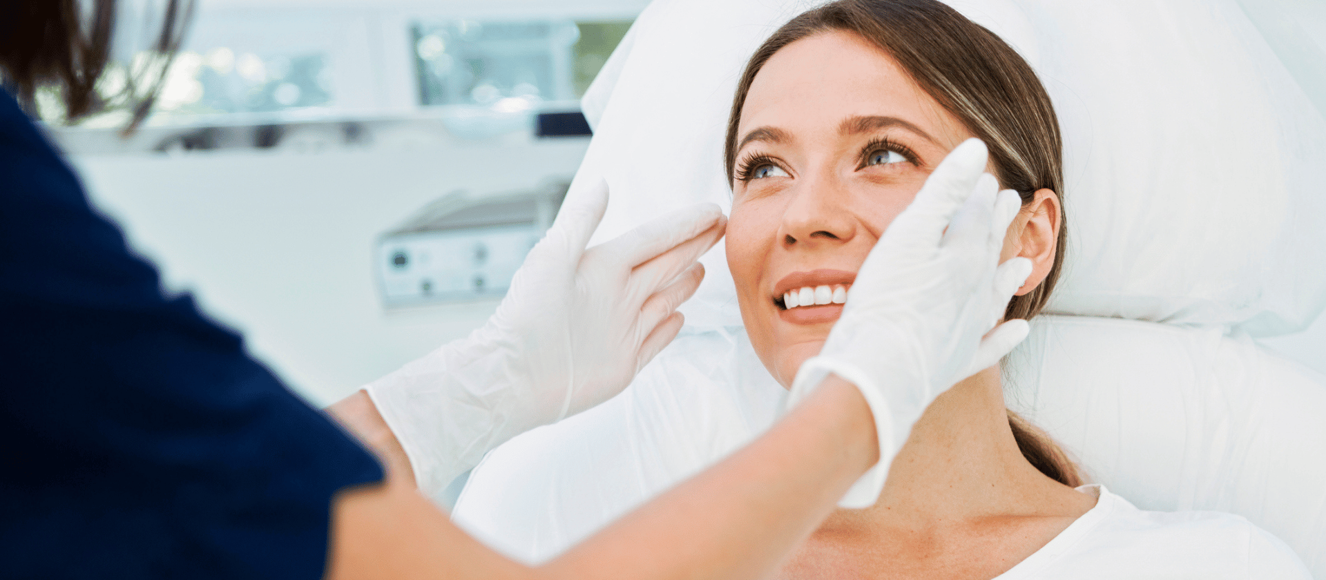 A young girl at her dermatology appointment getting a consultation on her face.